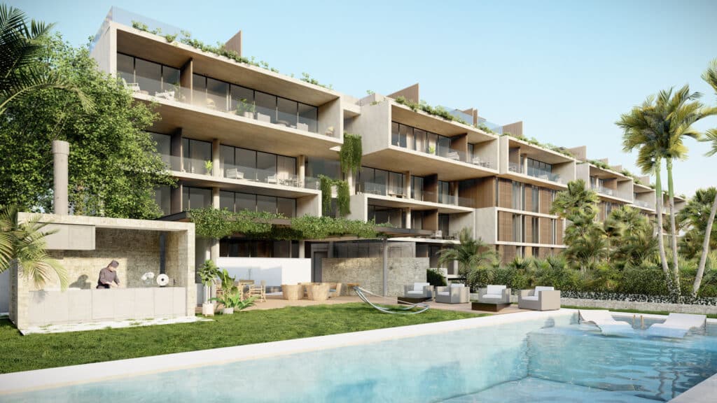 A modern multi-story residential building at Soleii C in Playacar Phase 1, Playa del Carmen, featuring spacious balconies, lush greenery, and an outdoor pool area.