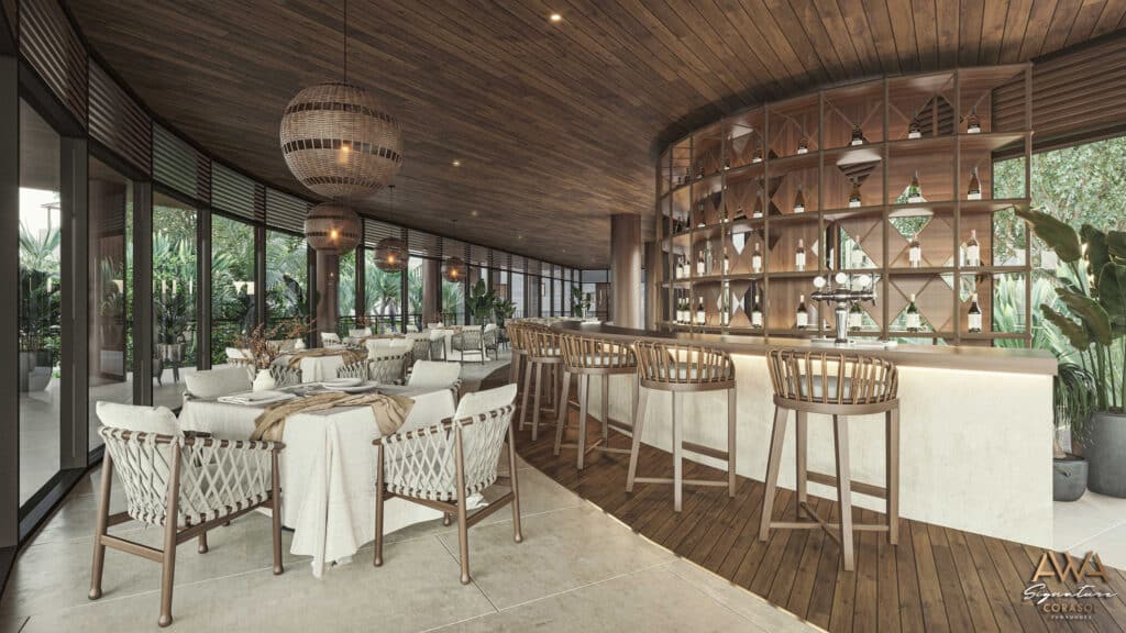Interior view of the AWA Corasol PH D in Playa del Carmen, featuring a stylish bar area with wooden accents, bar stools, and large windows overlooking lush greenery.