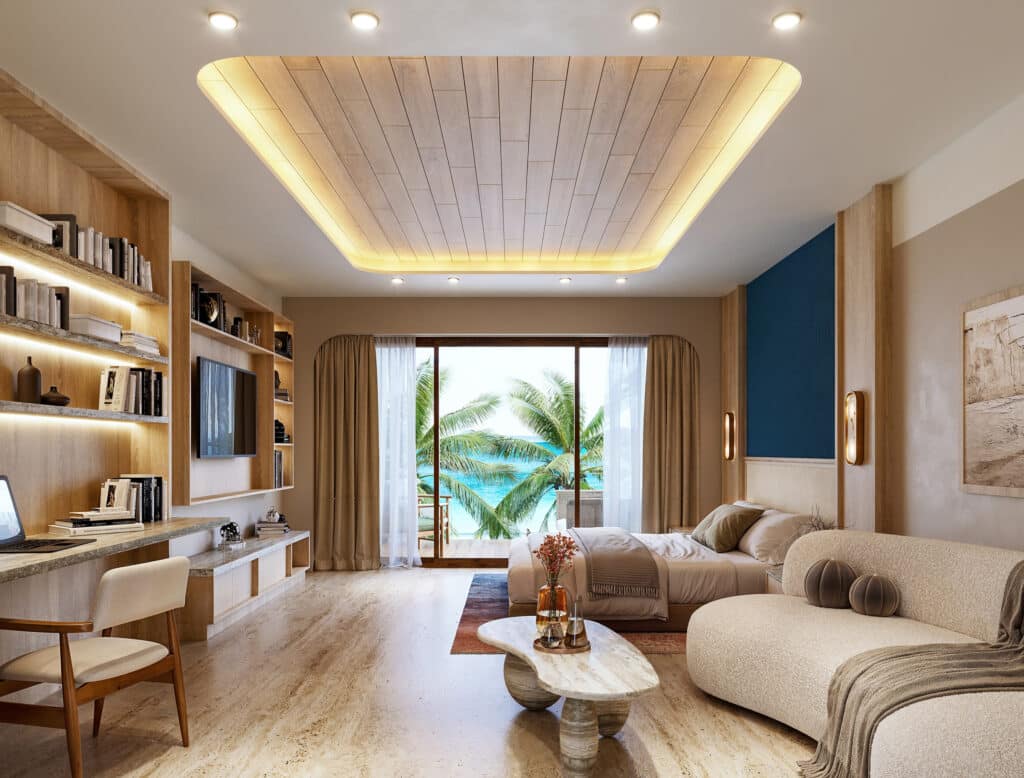 A modern beachfront living room in Saint Marine 305, Playa del Carmen, featuring a large sliding glass door opening to ocean views with a bed, sofa, bookshelf, and warm lighting.