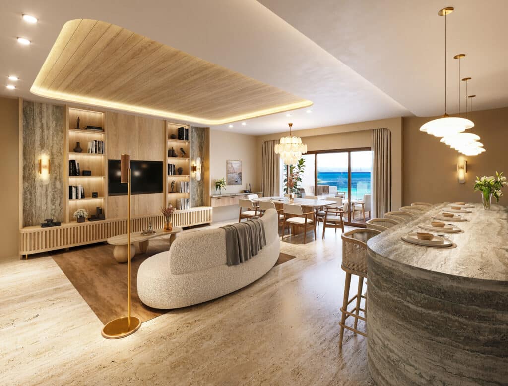 Interior view of Saint Marine 305 in Playa del Carmen featuring a spacious living area with a built-in bookshelf, modern furniture, and ocean views through large sliding doors.