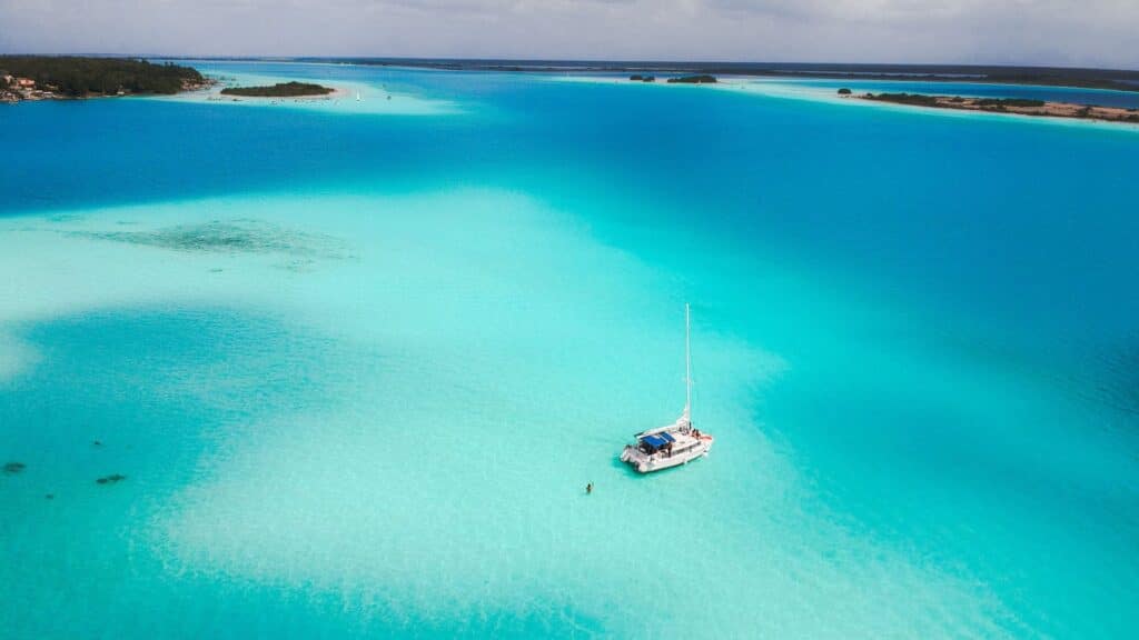 drone photo of boat on bacalar lagoon