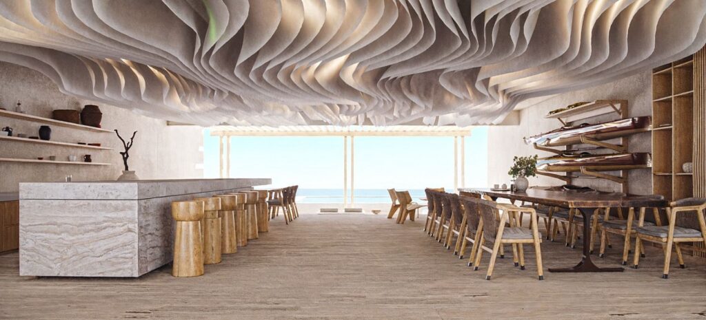 A spacious, modern interior with a textured ceiling, overlooking the seaside, featuring wooden furniture and decor, located in Maranta 203 Beachfront in Tulum.