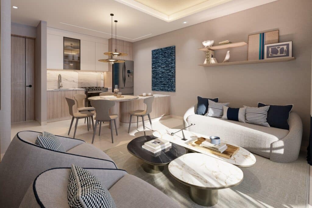 A modern living area in Nautica 402, Cancun, featuring a neutral color palette, contemporary furniture, a marble-topped coffee table, and decorative wall arts in Laguna Nichupte.