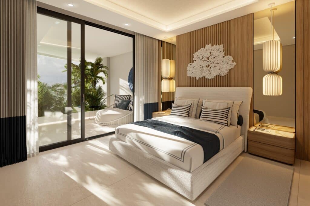 A modern bedroom in Nautica 402, Cancun, featuring a large bed with striped pillows, a textured headboard, hanging pendant lights, and a balcony with lush tropical plants.
