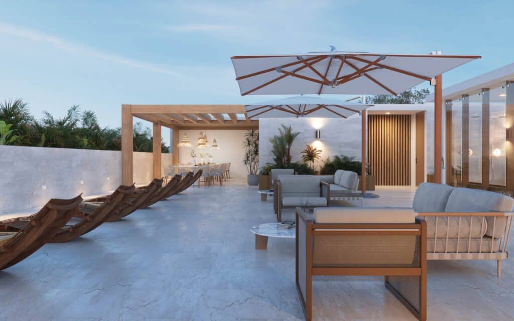 Distrito Zen Cancun 407 rooftop terrace with outdoor furniture, sun loungers, umbrellas, and dining area in Puerto