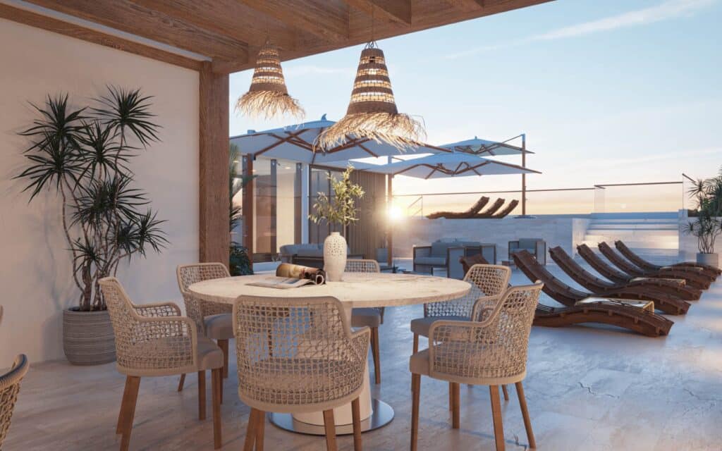 Distrito Zen Cancun 407 outdoor rooftop terrace with sun loungers and seating area at sunset in Cancun's Puerto Cancun area