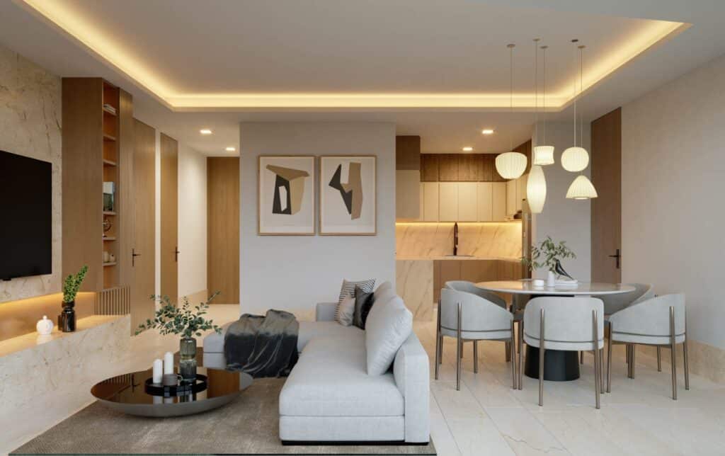 Interior of Distrito Zen Cancun 407 in Puerto Cancun, showing a living room with a white sofa, artwork, and dining area