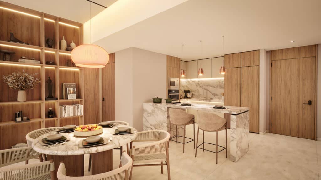 Modern kitchen and dining area at Bay View Grand, Cancun, featuring wooden cabinets, marble countertops, and a cozy dining setup on Grand Island.