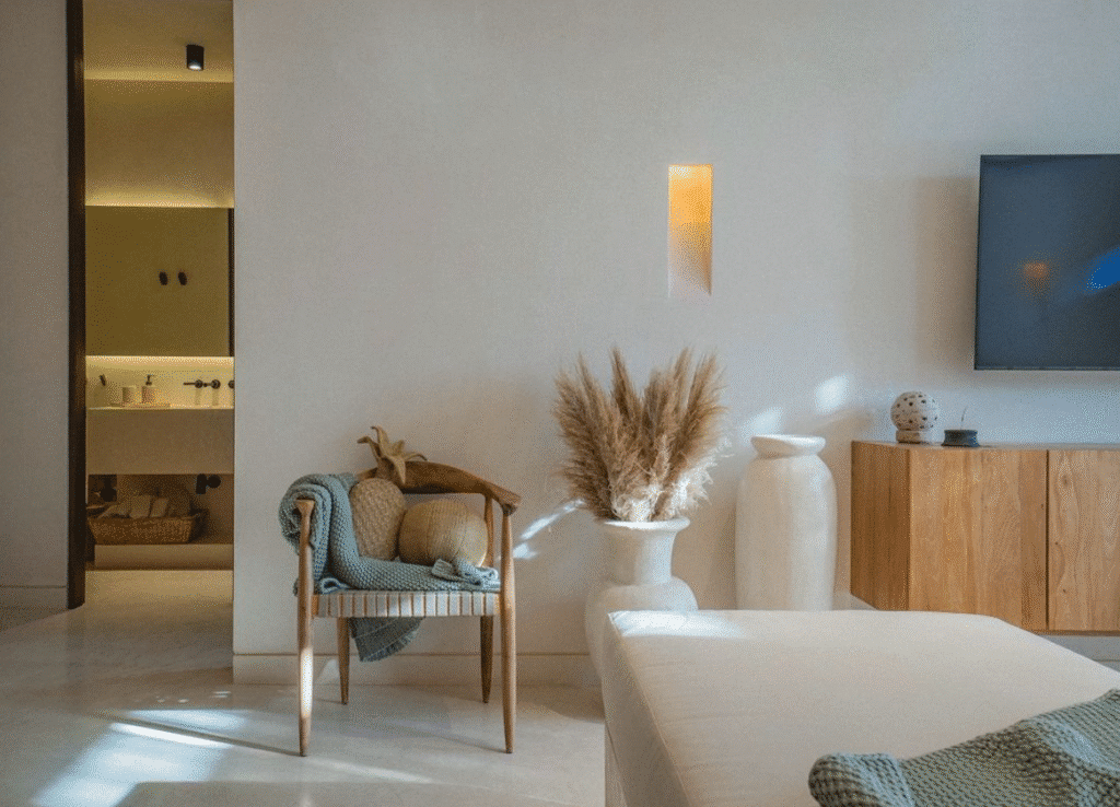Interior view of a modern living area at Namas 13 in Tulum's La Veleta, featuring neutral tones, minimal decor, and natural light.