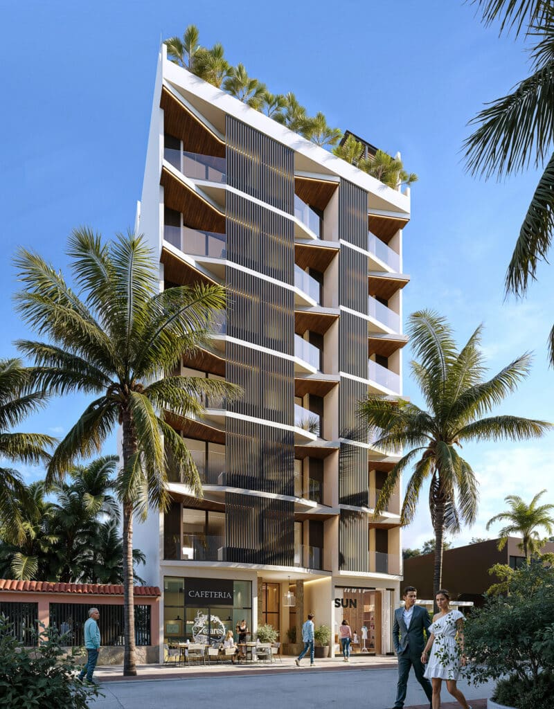 Petrus in Playa del Carmen is a modern building with multiple balconies, surrounded by palm trees and featuring a ground-level café and pedestrian activity in Playa Centro.