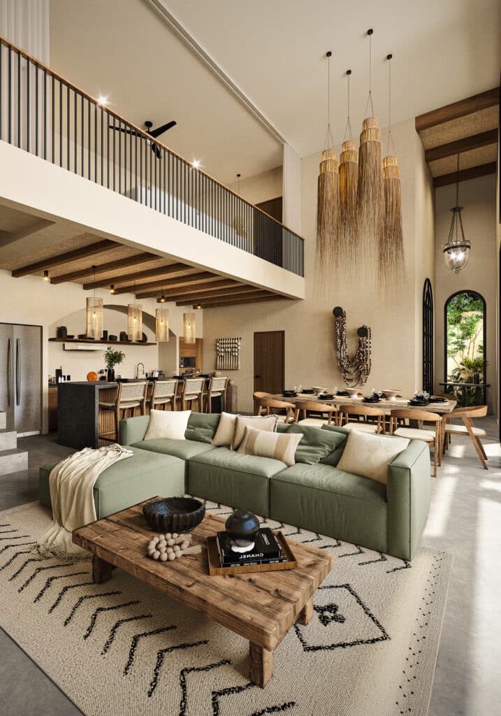 Interior view of a spacious living and dining area in Satori Korin, Tulum, featuring high ceilings, a green sectional sofa, wooden accents, and modern decor.