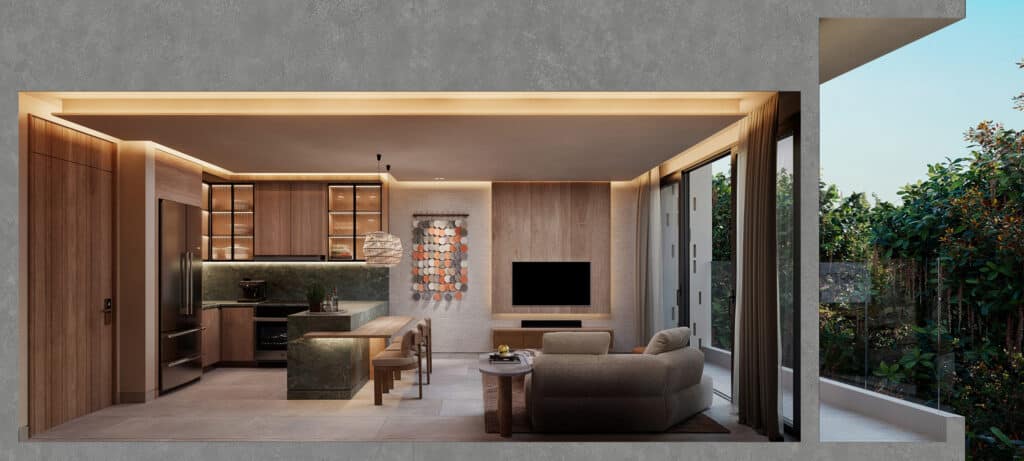 Interior view of a Belmare beachfront condo in Tulum, featuring a modern living area with wooden furniture, a TV, large glass doors, and lush greenery outside.
