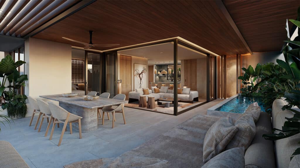 Living room and dining area of a beachfront condo at Belmare 312 in Tulum, featuring a modern design with a cozy sofa, wooden accents, and an outdoor pool surrounded by lush greenery.