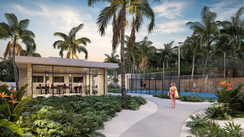 Duna Residences in Chuburna features a modern fitness room among lush tropical landscaping, with tennis courts and beach access nearby.
