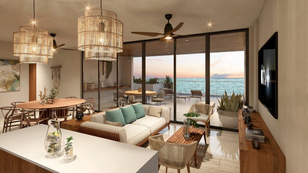 Living room with modern furniture and a view of the ocean on a beachfront property in Chuburna, part of Dunas development.