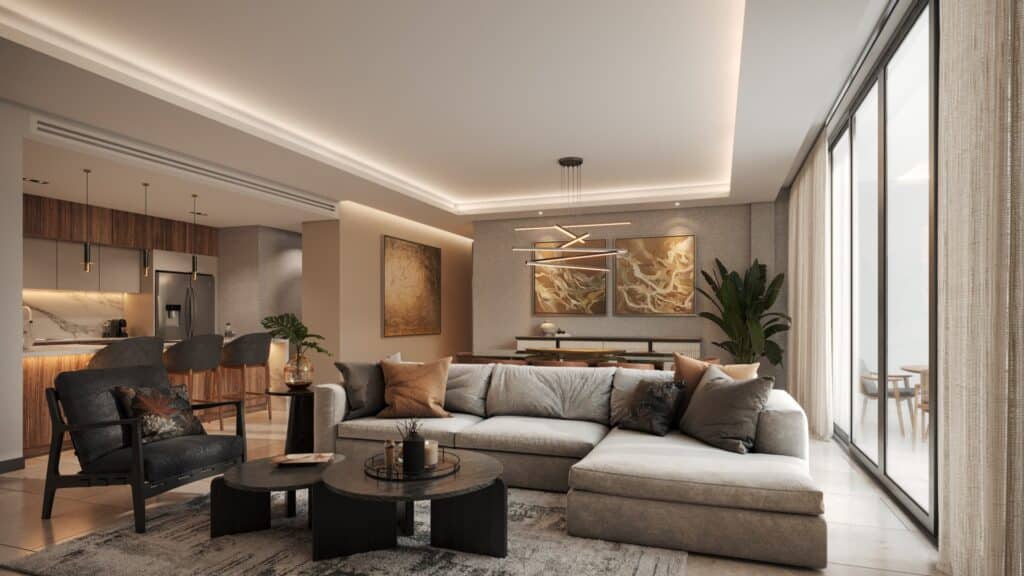 Interior of a modern living room at Lussela in Merida's Montecristo area, featuring a large beige sofa, black armchair, wooden coffee tables, artwork on the walls, and sliding.
