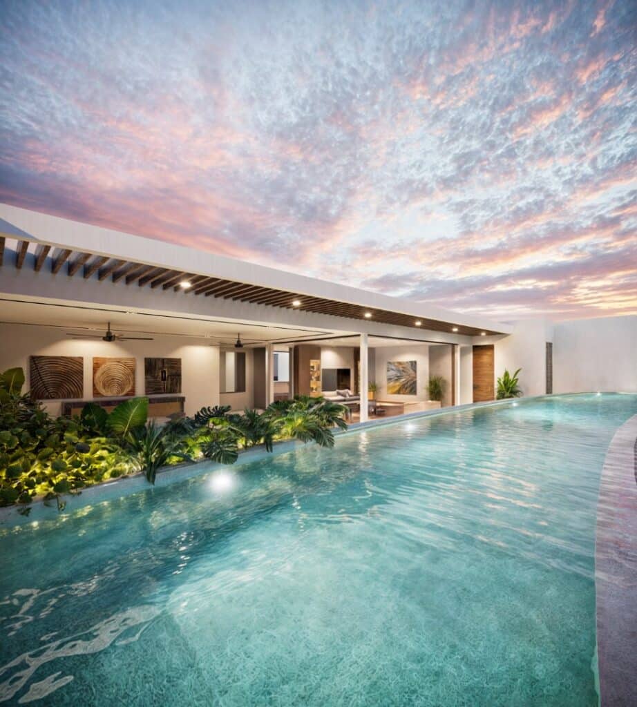 Modern home in Lussela, Montecristo, Merida, featuring a sleek swimming pool under a colorful sky at sunset.