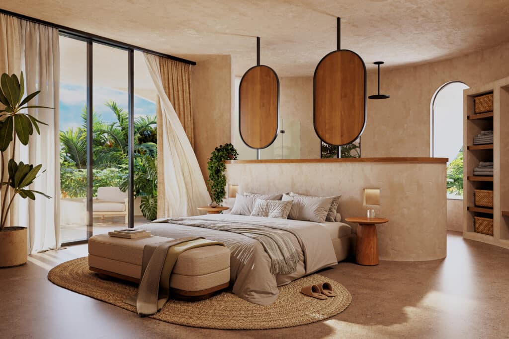 A spacious bedroom in Muuyal, Tulum, with neutral tones, a large bed, an outdoor balcony with lush greenery, and warm natural light filtering through large windows.