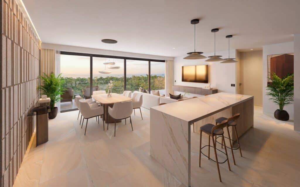 Modern, open-concept living space with a dining area, a wall-mounted TV, and large glass sliding doors offering city and nature views in Playa del Carmen.