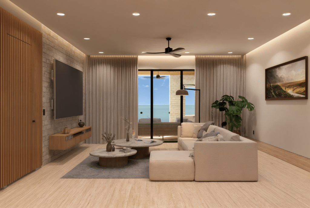 Modern living room with a large sliding glass door leading to a balcony overlooking the ocean at Luna Azul 101 in Bahia Xcacel, Puerto Aventuras.