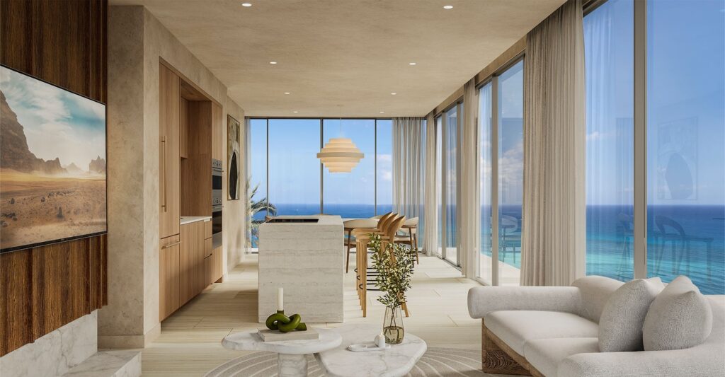 Living room with floor-to-ceiling windows showcasing ocean views, modern furniture, and minimalist decor at Viceroy Residences in Playa del Carmen.